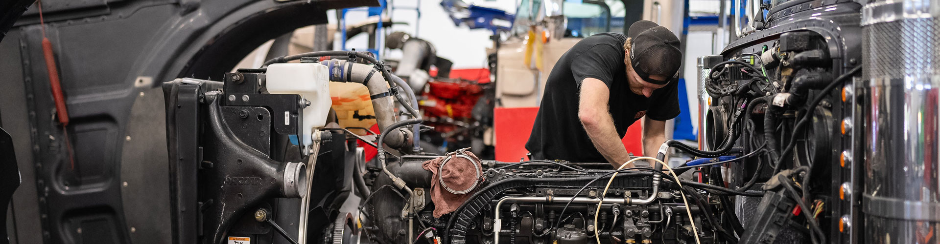 Pete Store Mechanic working diligently on semi-truck repair