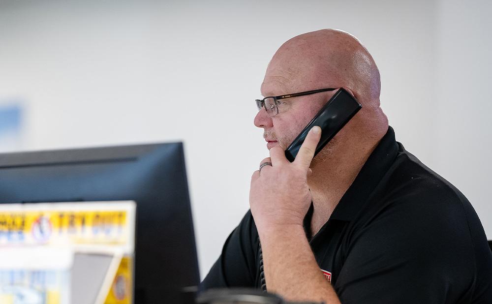 Pete Store employee diligently assisting a customer
